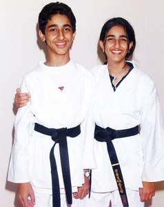 Sheikha Aran Bint Khalid Al Qasimi and Sheikh Hamed Bin Khalid Al Qasimi after their Black Belt awarding ceremony